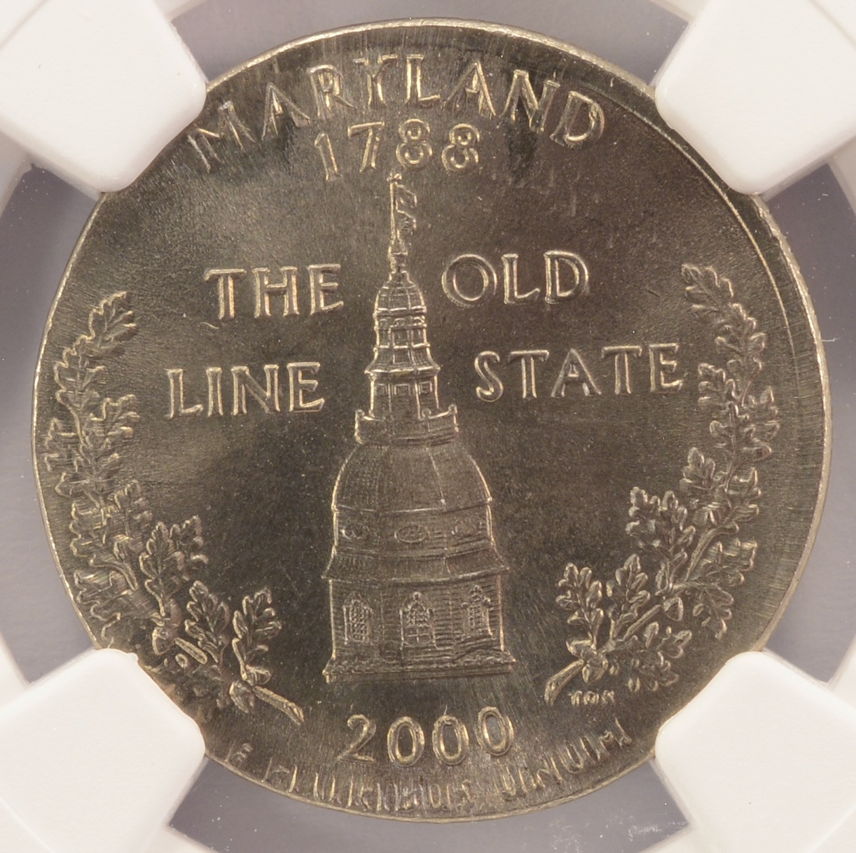 2000 quarter struck on Jefferson nickel planchet — smaller coin with truncated legends shown next to normal-size quarter for comparison